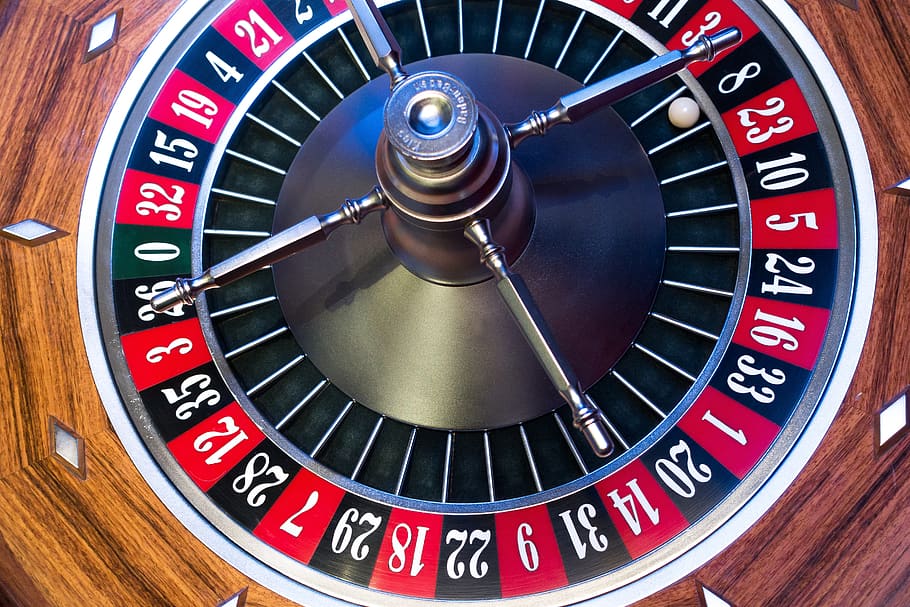 Close-up view of a roulette wheel with numbers and colors visible